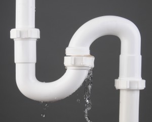 stock-photo-closeup-of-a-sink-s-trap-made-of-white-pvc-plastic-with-a-broken-connection-and-water-pouring-out-134565629